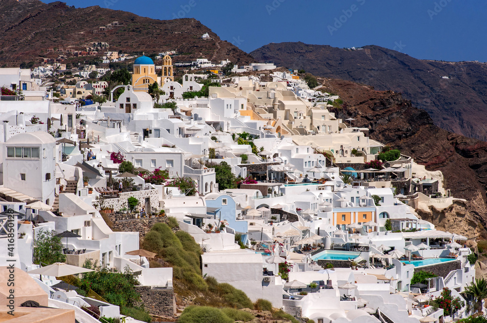 Fira, modern capital of the Greek Aegean island, Santorini. Santorini is iconic travel destination in Greece, famous of its sunsets and traditional white and blue architecture.