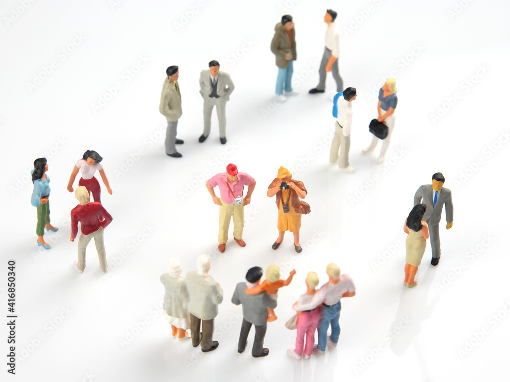 miniature people. different people communicate with each other on a white background miniature people. different people communicate with each other on a white background