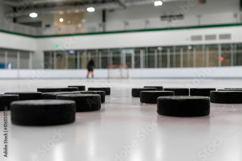 Hockey pucks on an ice rink
