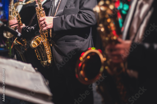 Photography Concert view of a saxophonist, saxophone sax player with vocalist and musical du