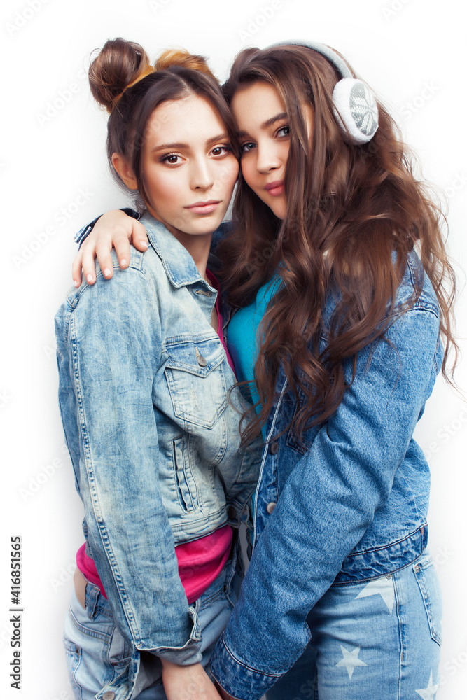 lifestyle and people concept: Fashion portrait of two stylish sexy girls best friends, over white background. Happy time for fun lifestyle and people concept: Fashion portrait of two stylish sexy girls best friends, over white background. Happy time for fun