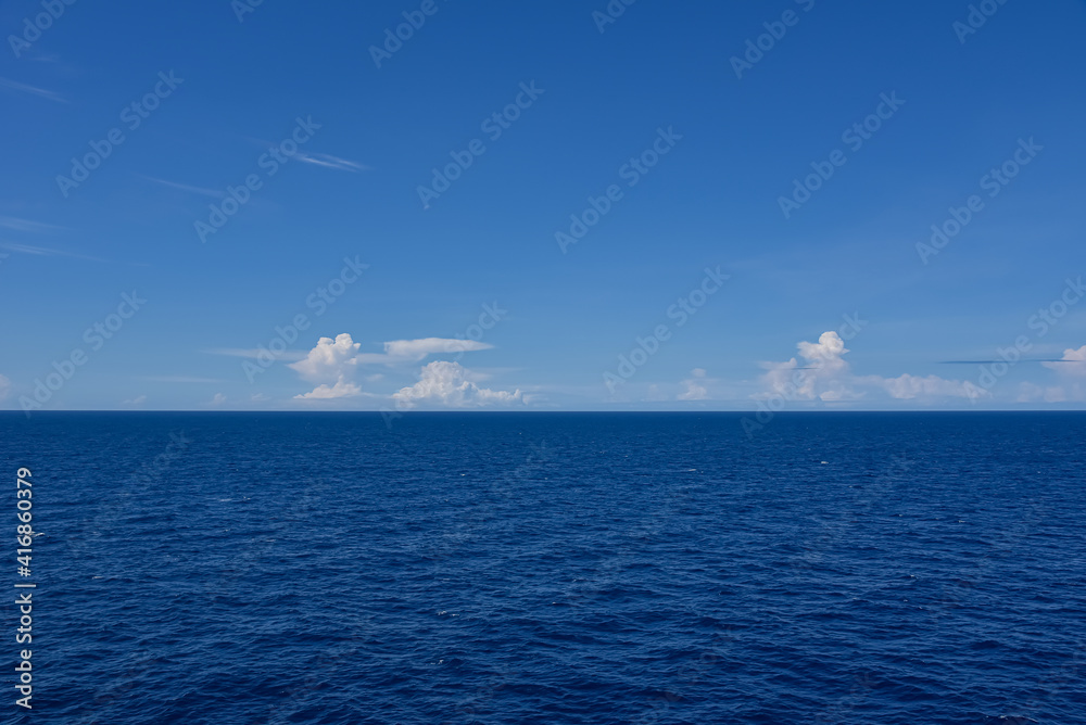 Beautiful seascape ocean horizon and blue sky at summer season. Beautiful seascape background concept and empty space. Beautiful seascape ocean horizon and blue sky at summer season. Beautiful seascape background concept and empty space.