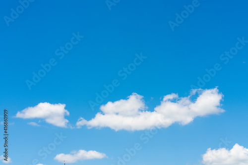White clouds on blue sky background, copy space
