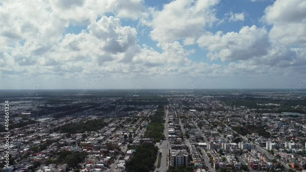Pedestal down camera shot with drone over the Cancun city in Quintana Roo with clouds and a sunny day Pedestal down camera shot with drone over the Cancun city in Quintana Roo with clouds and a sunny day