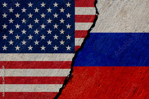 usa and russia flags painted on concrete wall
