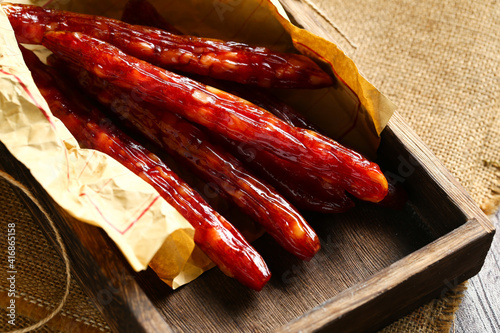 sausage in wooden box