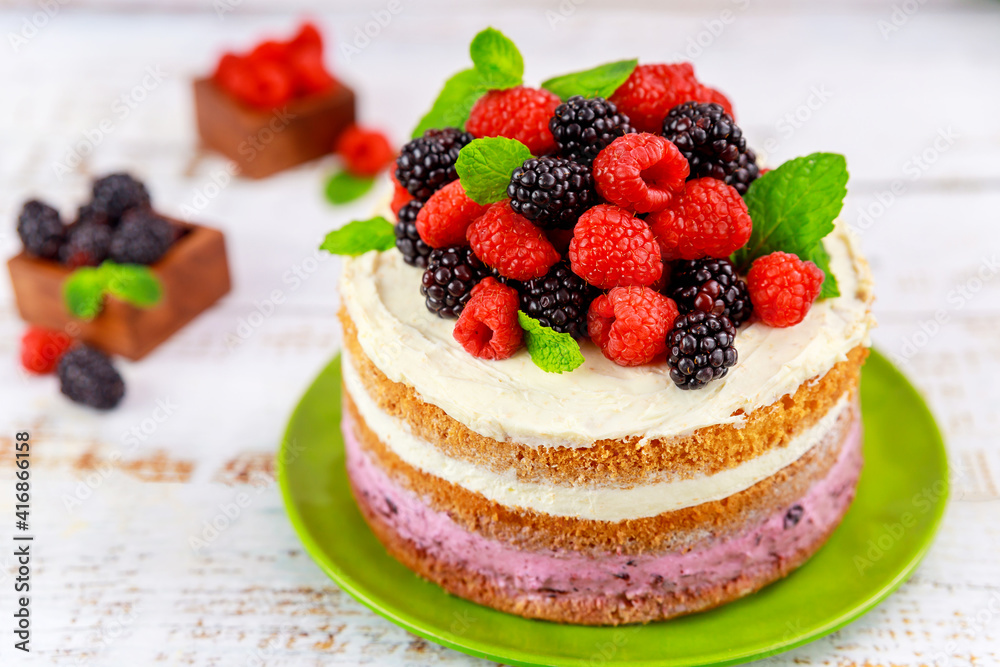 Sponge cake with vanilla cream and fresh berries. Sponge cake with vanilla cream and fresh berries.