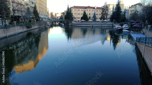 Slow motion reflection of the city on the canal. Eskisehir, Turkey.