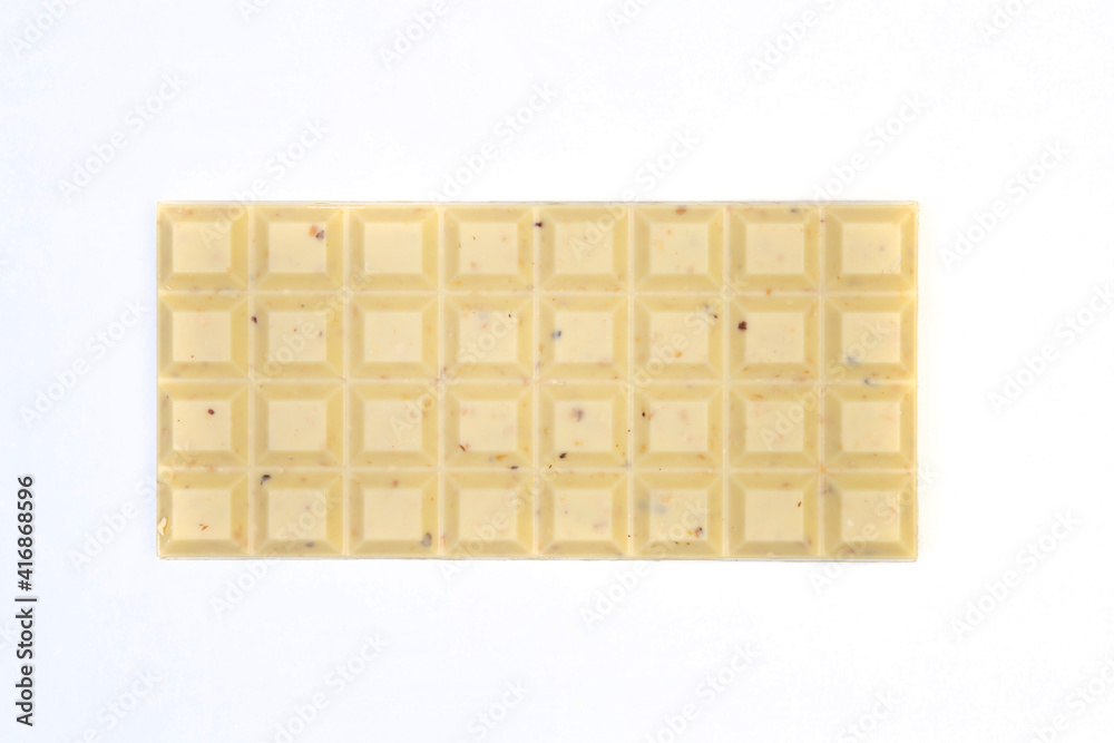 sweet and delicious whole chocolate bar is lying on white background, photo taken from above sweet and delicious whole chocolate bar is lying on white background, photo taken from above