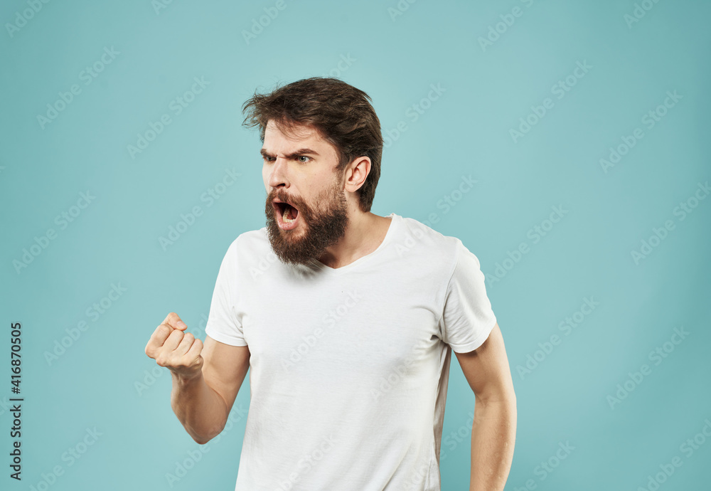 Emotions man model blue background white t-shirt cropped view Emotions man model blue background white t-shirt cropped view