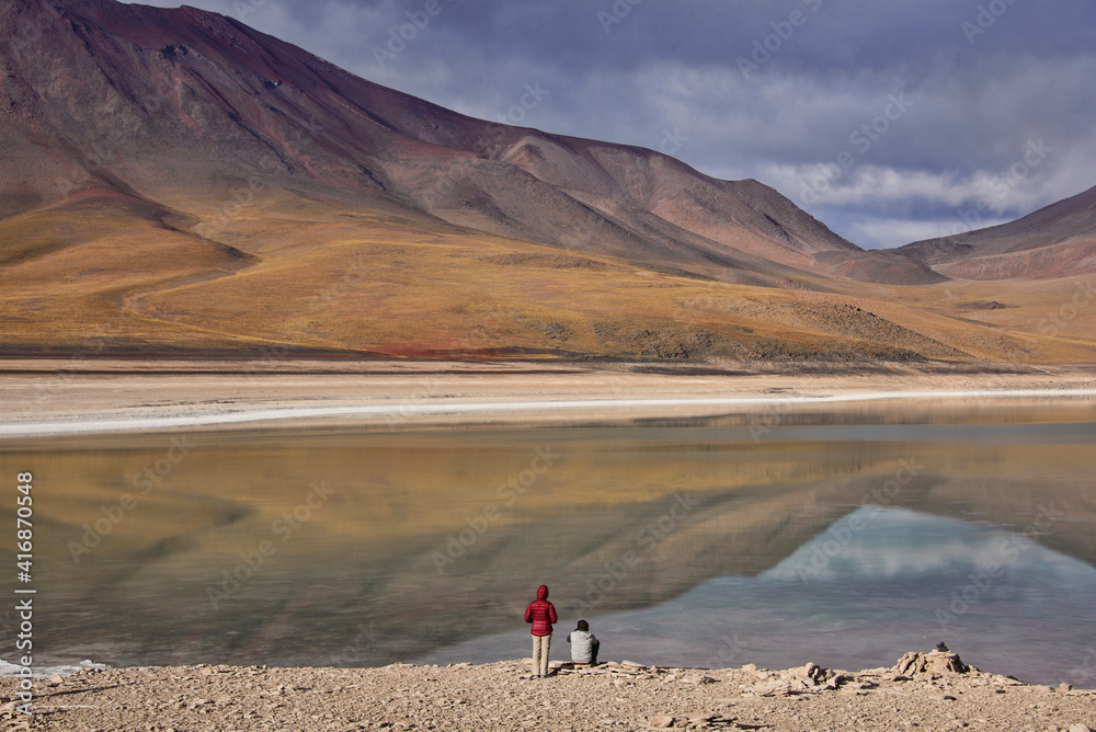 Tourists enjoying the view of Licancabur Volcano and Laguna Verde, Salar de Uyuni, Bolivia