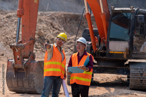 Construction engineers who take care of the progress of construction projects.Supervisors using laptop at construction site