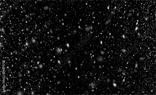 Snowfall on black background, an abstract background,Defocused Lights .