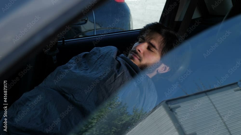 consequences of the lockdown- man in crisis with his wife sleeping in the car