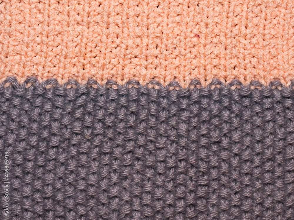 Fototapeta premium Multicolored ornament knitted from woolen threads. 
