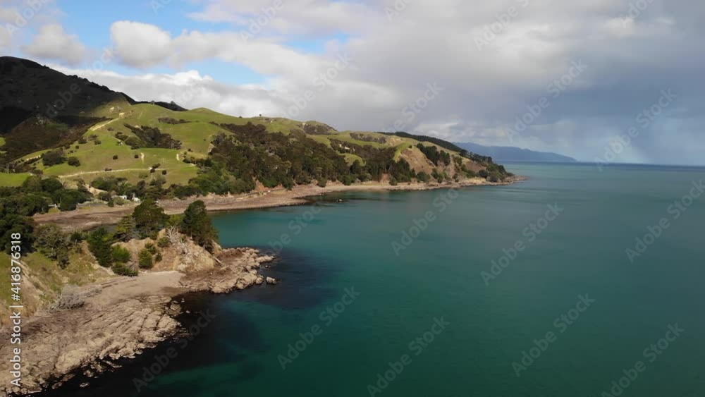 Aerial view beautiful turquoise clear water on a cloudy day, New Zealand coastline. Aerial view beautiful turquoise clear water on a cloudy day, New Zealand coastline.