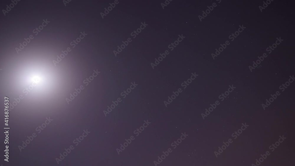 Timelapse moon moving on the sky. Stars blinking. Cloudy night. Timelapse moon moving on the sky. Stars blinking. Cloudy night.