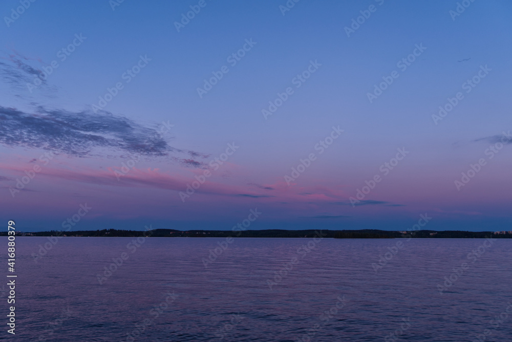 Colorful sky and lake after sunset; beautiful horizon