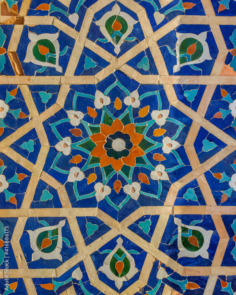 Beautiful blue tile floral and geometric design on wall of Gur e Amir, mausoleum of Amir Timur or Tamerlane, ancient landmark in UNESCO listed Samarkand, Uzbekistan