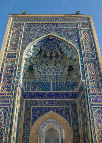 Low angle view of blue tile decor on the iwan entrance gate to Gur e Amir, mausoleum of Amir Timur or Tamerlane, ancient landmark in UNESCO listed Samarkand, Uzbekistan