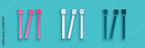 Paper cut Matches icon isolated on blue background. Paper art style. Vector.