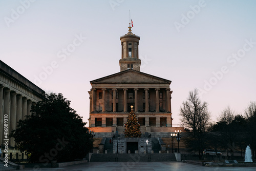 Tennessee State Capitol building and mall in the evening with Christmas tree and lights.