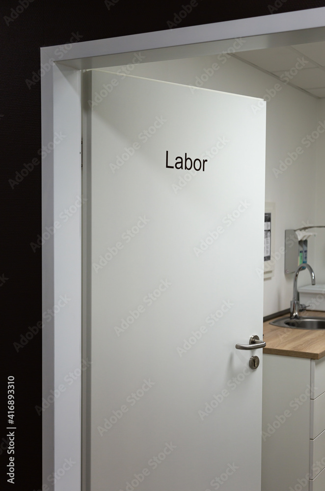 a half open door to the laboratory room in a doctor's surgery a half open door to the laboratory room in a doctor's surgery