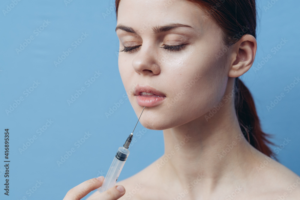 woman holding syringe in hand botox injection operation change of appearance