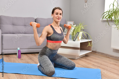 Young woman practing sport at home photo