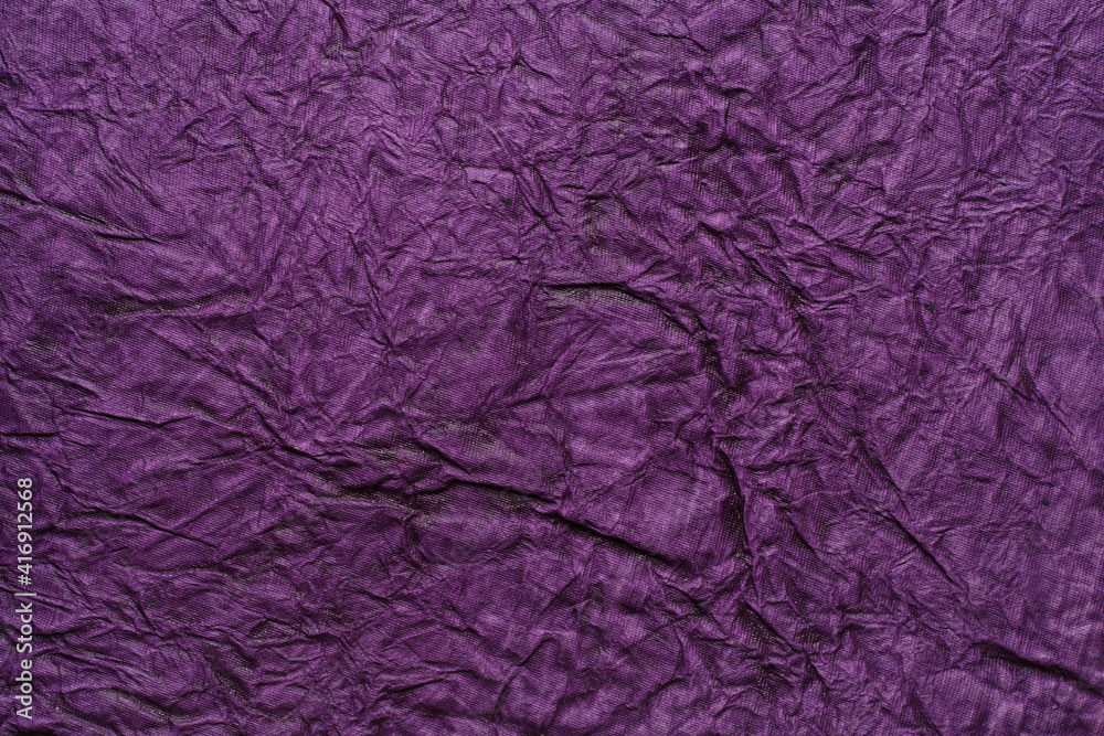 Beautiful purple color handmade paper of wrinkle texture with veins and fibers. Useful for background, 3d rendering.