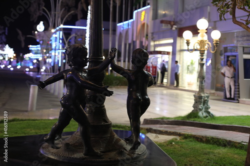 beautiful bronze sculptures at night