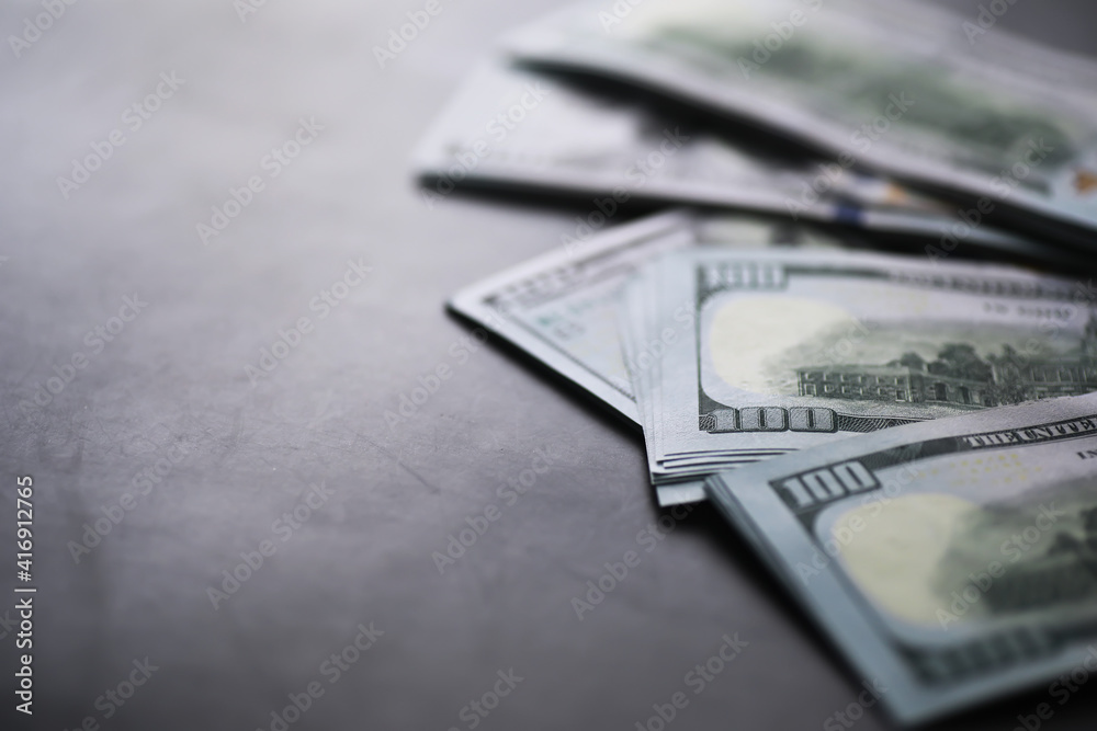 Group of money stack of 100 US dollars banknotes a lot of the background texture. Cash money in a large pile as a finance background. Group of money stack of 100 US dollars banknotes a lot of the background texture. Cash money in a large pile as a finance background.