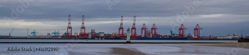Billede på lærred New Brighton lighthouse with Liverpool docks in the background