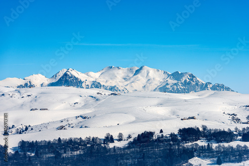 Lessinia High Plateau (Altopiano della Lessinia) and the Mountain range of the Monte Carega in winter with snow, also called the small Dolomites. Veneto and Trentino Alto Adige, Italy, Europe.