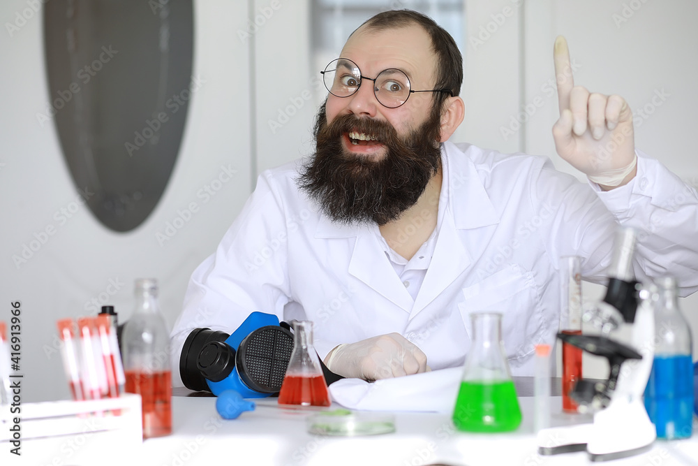 Chemist crazy. A mad scientist conducts experiments in a scientific laboratory. Performs research using a microscope. Chemist crazy. A mad scientist conducts experiments in a scientific laboratory. Performs research using a microscope.