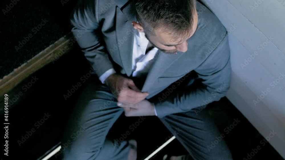 man in a suit on the stairs man in a suit on the stairs