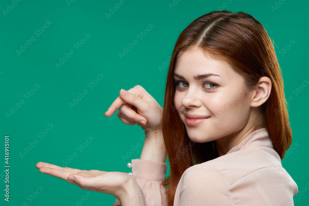 emotional woman holding palm near herself lifestyle studio isolated green background emotional woman holding palm near herself lifestyle studio isolated green background