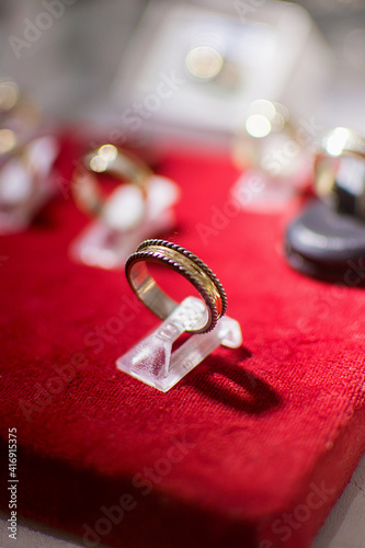 wedding rings on red silk