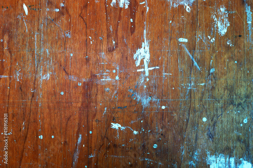 Old wooden background with colorful paint stains