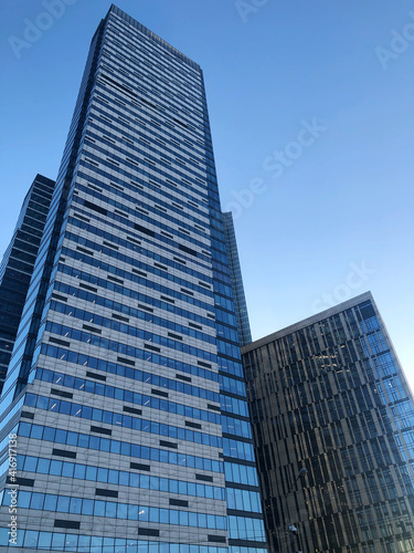 Detail of the facade an office building in the future against the blue sky