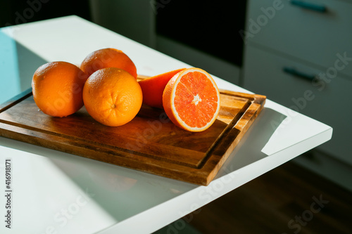 Healthy lifestyle. Fresh delicious clean. Copy space. Vegetarian food. There are products on a white table. Healthy food. Real live vitamin C. Seasonal Citrus fruits Red oranges grapefruit.