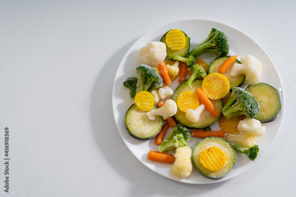Frozen vegetables. Carrots, cabbage, broccoli, cauliflower, zucchini.
