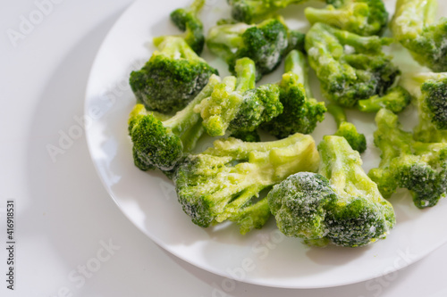Frozen vegetables. Broccoli. White background