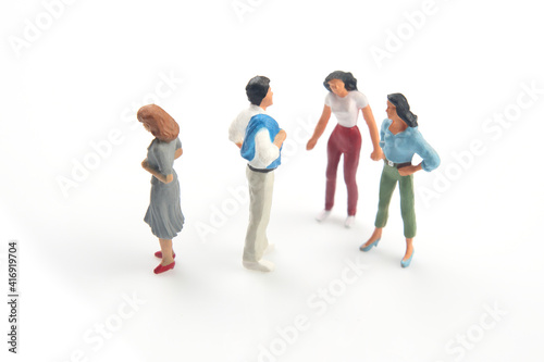 miniature people. concept of family people in relationships on a white background. the problem of fidelity in marriage. © photosaint