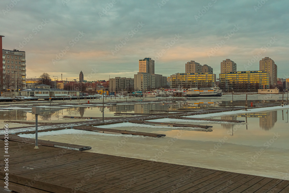 Finland, Helsinki, February 26, 2021
  Spring panorama of Helsinki, view of the Katajanokka and Krununhakka area in the foreground the Gulf of Finland and berths for boats