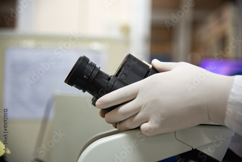 MIcroscope in laboratory with blur  background.
