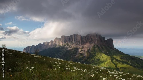 The formation and movement of clouds over the summer slopes of Adygea Bolshoy Thach and the Caucasus Mountains