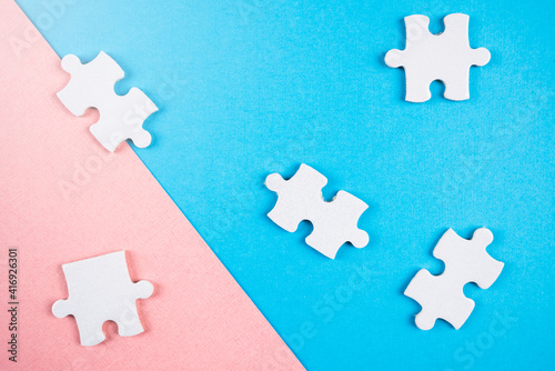 Puzzle pieces on pink and blue background. © Jon Anders Wiken