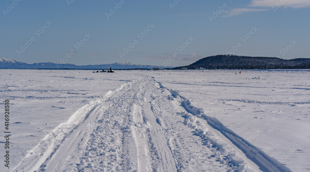 road on the frozen sea made by fishermen road on the frozen sea made by fishermen