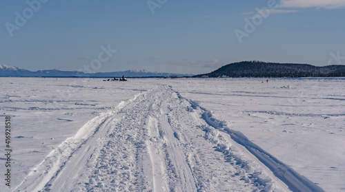 road on the frozen sea made by fishermen
